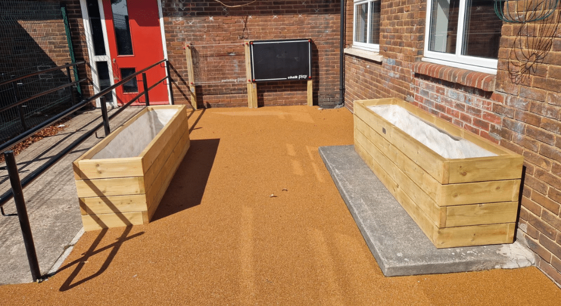 Wooden Scales, Chalk Board, Perspex Board, Planter Playground Equipment And Wetpour Safety Surfacing