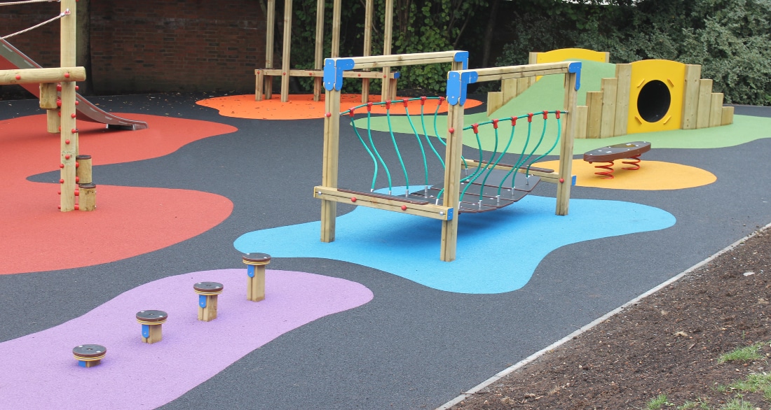 A colourful surfaced outdoor play area