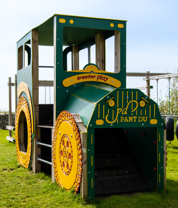 Green Wooden Tractor in field