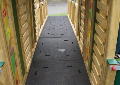 Timber tunnel in an inclusive play tower