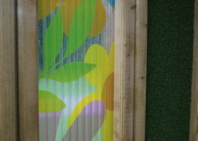 Translucent colourful floral side panel of sensory play equipment