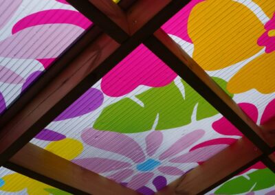 Multi-coloured floral ceiling of a playground sensory tunnel
