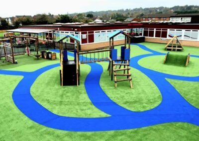 Arial image of St Peter's Catholic Primary School, featuring a timber playhouse, with a bespoke two tower timber play tower.