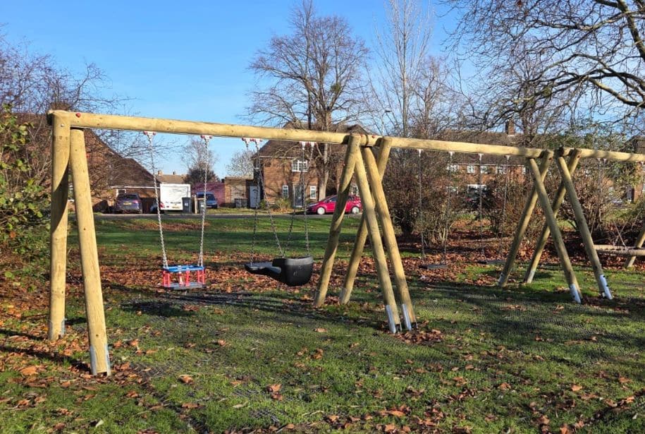 Quad Swing Round This Image Shows A Quad Swing Round Swing Set In A Local Playground In The Uk.