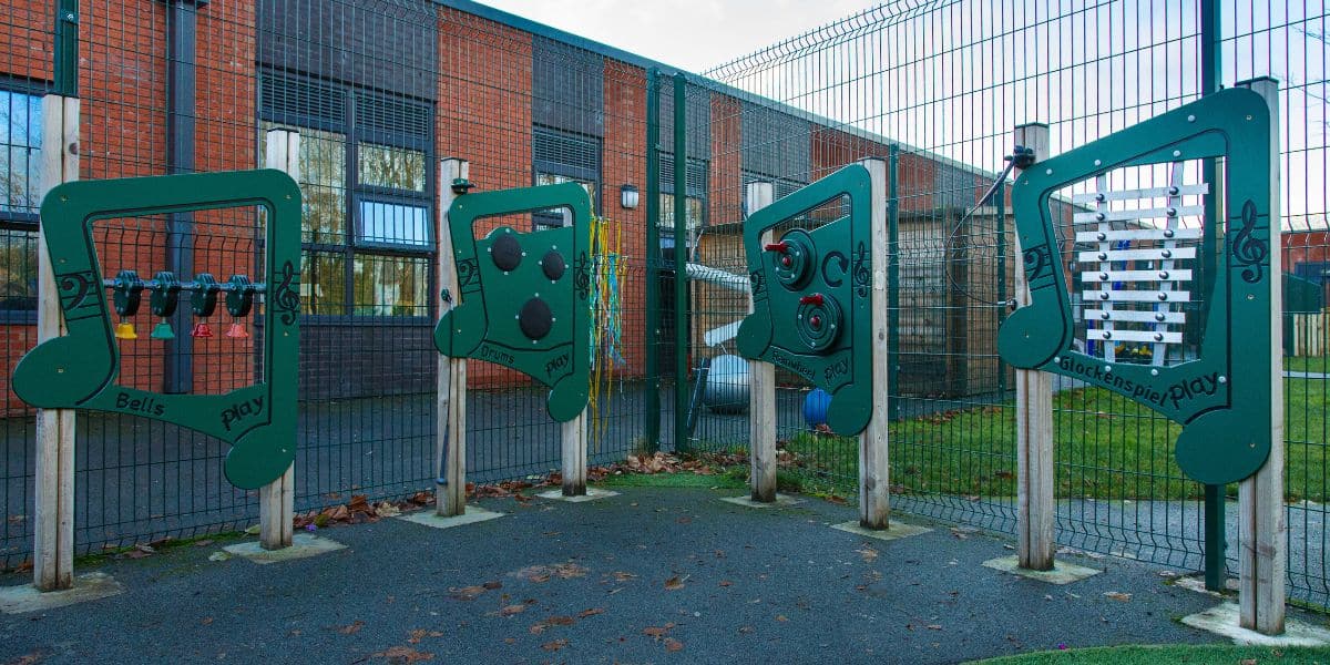 This image depicts Creative Play's inclusive sensory playground equipment, including music boards and instruments