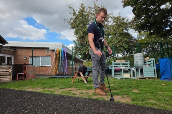 This image shows our Outdoor Playground Expert Simon out on a site visit