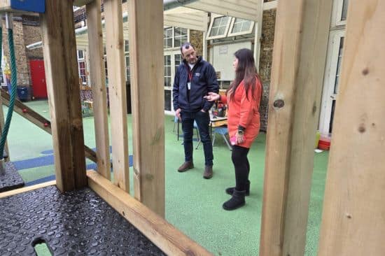 This image shows our Outdoor Playground Expert Travis out on a site visit