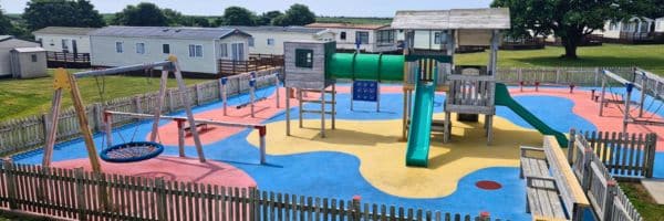 This image shows a playground area at a holiday park int he UK designed, built and installed by Creative Play.