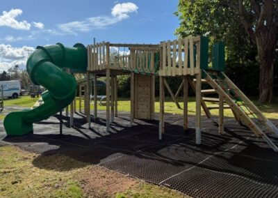 This image shows a playground timber play tower playground equipment installed at Uffculme Parish Council in Tiverton