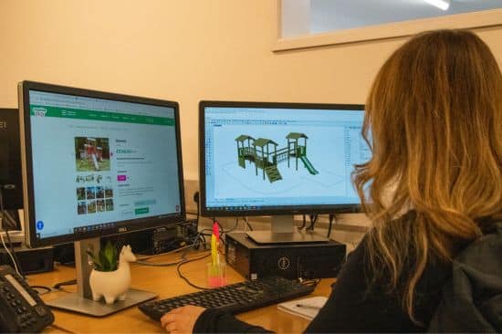 This image shows a female product designer working on  3D design image of a playground product