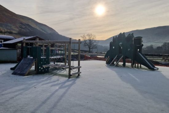 This image shows a dart activity centre and a dinosaur climbing frame 