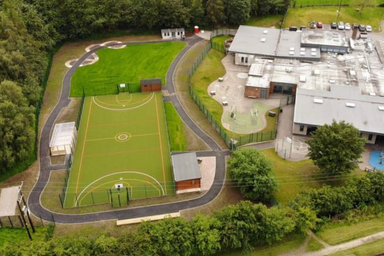 This image shows drone footage of a secondary school with a Multi Use Games Area