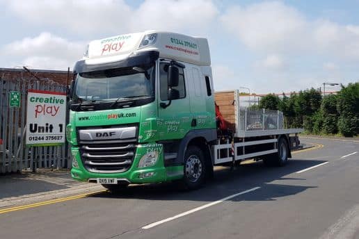 Flatbed truck featuring Creative Play branding