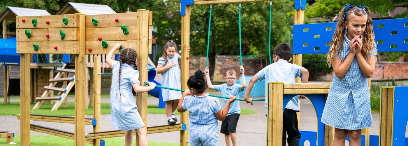 This image shows children playing on playground equipment in the UK.