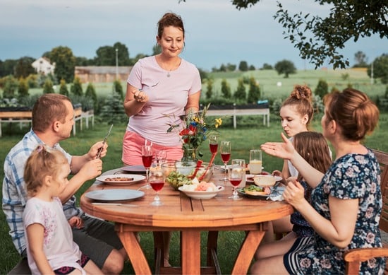 Family enjoying a meal sat outside