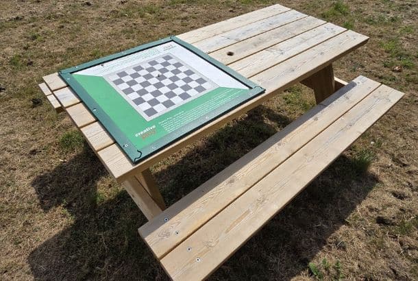 Draughts Games Top This Image Shows A Draughts Games Top On Top Of A Picnic Bench