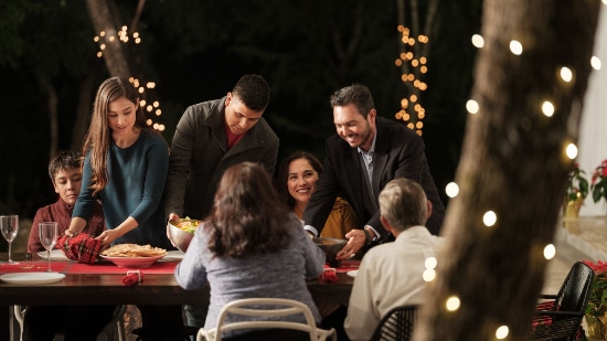 People enjoying a meal outdoors at night