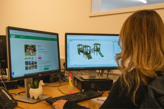 This image shows a female designer working on a playground design image on the computer