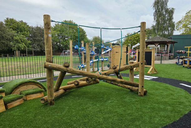 This image shows a jungle climber voyager on artificial grass safety surfacing