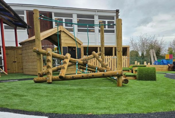 This image shows a jungle climber voyager on artificial grass safety surfacing