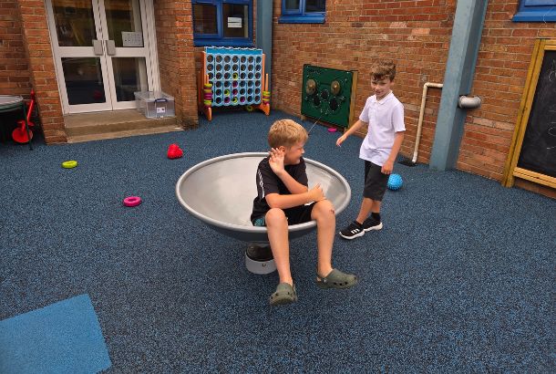 This image shows children playing in a rota roka