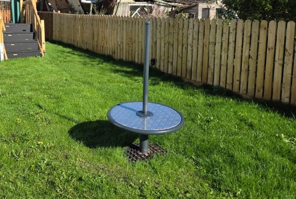 This image shows a spinner with pole on grass surfacing