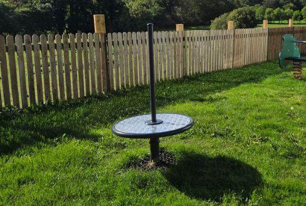 This image shows a spinner with pole on grass surfacing